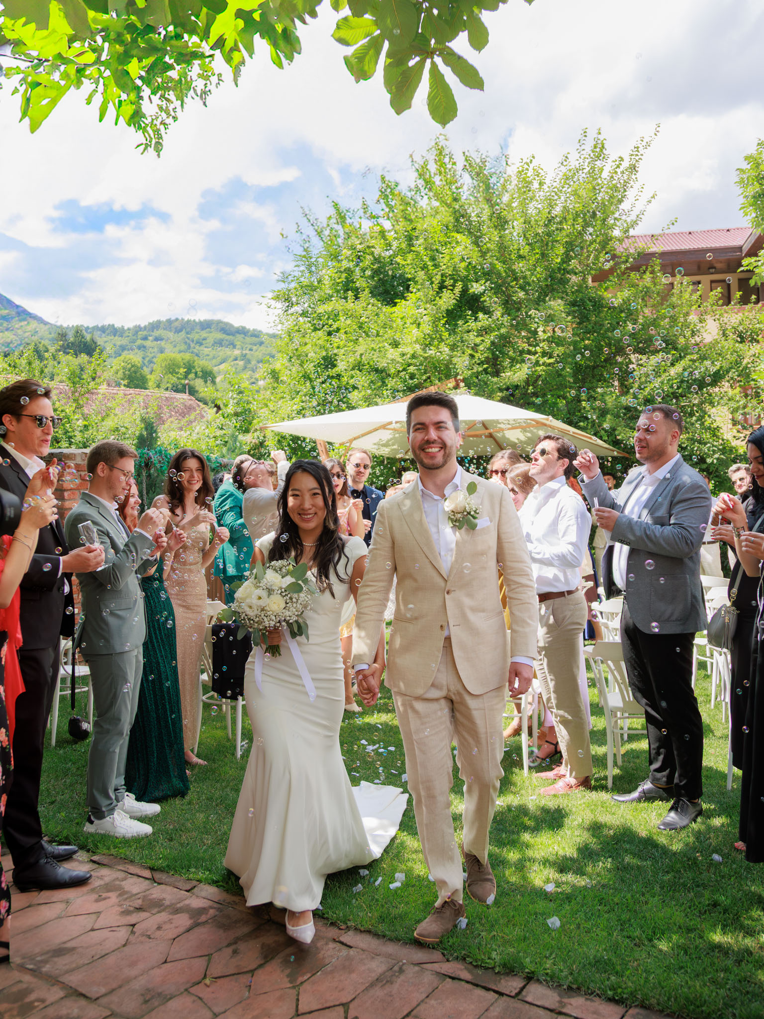 Anita Tissier Photography - Couple walking out right after getting married at their wedding in Brasov, Romania