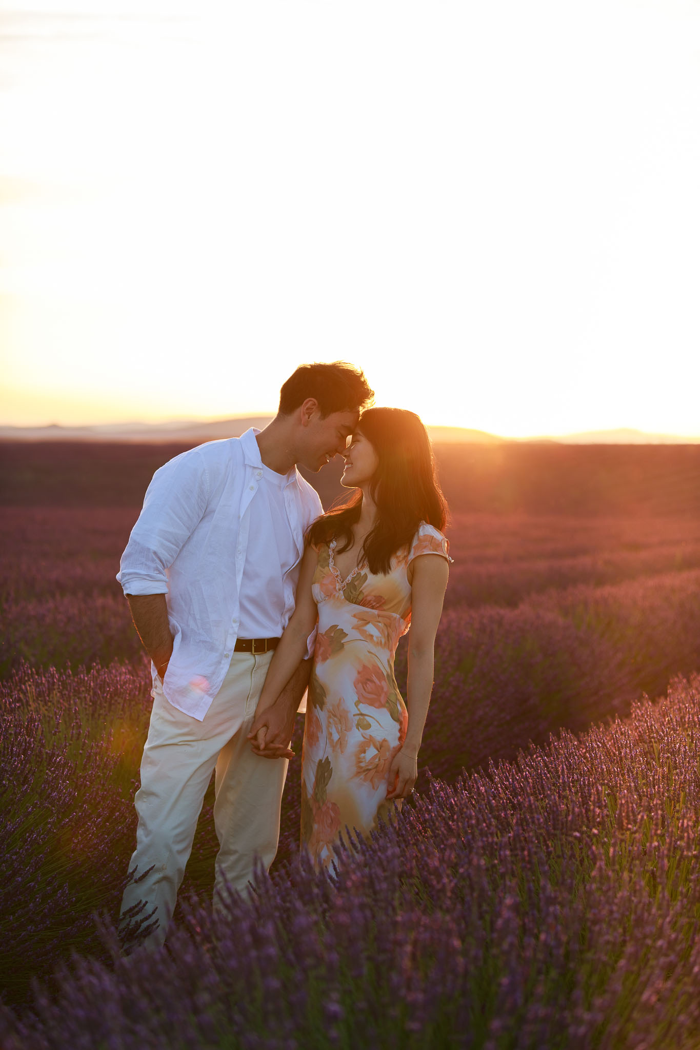 Romantic sunset surprise marriage proposal in Provence; a couple captured in the blooming lavender fields of Valensole, France